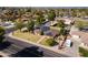 Charming single-Gathering home featuring solar panels, a well-manicured front yard, and a detached garage at 1610 E Mclellan Rd, Mesa, AZ 85203