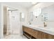 Elegant bathroom boasting a double vanity, modern mirrors, and luxurious walk-in shower at 1610 E Mclellan Rd, Mesa, AZ 85203