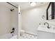 Updated bathroom with black fixtures, white vanity and hexagon tile floors at 1610 E Mclellan Rd, Mesa, AZ 85203