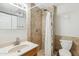 Bathroom featuring light tile walls, a toilet, and a vanity with mirror above at 1610 E Mclellan Rd, Mesa, AZ 85203