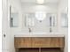 Chic bathroom highlighting a double vanity with quartz counters, modern fixtures and lighting at 1610 E Mclellan Rd, Mesa, AZ 85203