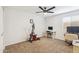 Well-lit bedroom area with an exercise bike, desk, and chair, perfect for a home gym at 1610 E Mclellan Rd, Mesa, AZ 85203