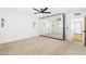 Bright bedroom featuring a modern ceiling fan and closet with mirrored doors at 1610 E Mclellan Rd, Mesa, AZ 85203