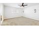 Bright bedroom with modern ceiling fan, carpeted floor and a feature wall at 1610 E Mclellan Rd, Mesa, AZ 85203