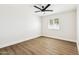 Bright bedroom featuring modern ceiling fan and contemporary wood-look flooring at 1610 E Mclellan Rd, Mesa, AZ 85203