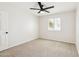 Empty bedroom featuring a window and neutral-colored carpet at 1610 E Mclellan Rd, Mesa, AZ 85203