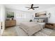 Serene bedroom with neutral colors, decorative wall art, and coordinated furnishings with plush rug and ceiling fan at 1610 E Mclellan Rd, Mesa, AZ 85203