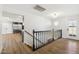 View of the front foyer, landing and entry to the kitchen with wood-look floors at 1610 E Mclellan Rd, Mesa, AZ 85203