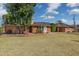 Charming single-story brick house with well-kept lawn, solar panels, and beautiful landscaping at 1610 E Mclellan Rd, Mesa, AZ 85203