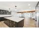 Bright kitchen features a large island, modern appliances, and seamlessly connects to the open-concept living area at 1610 E Mclellan Rd, Mesa, AZ 85203