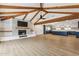Spacious living room with a fireplace, vaulted ceilings, and modern flooring that flows into the kitchen at 1610 E Mclellan Rd, Mesa, AZ 85203