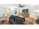 Comfortable living room with wood floors, a sectional and a view into the kitchen at 1610 E Mclellan Rd, Mesa, AZ 85203