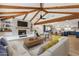 Open concept living room featuring a fireplace, built-in shelves, a large sofa, and a view into the kitchen at 1610 E Mclellan Rd, Mesa, AZ 85203
