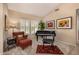 Cozy living room featuring plush seating, shutters and neutral decor at 16210 W Desert Winds Dr, Surprise, AZ 85374