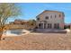 This expansive backyard includes a pool and gravel landscaping at 1713 S 117Th Dr, Avondale, AZ 85323