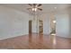 A spacious main bedroom has a ceiling fan and leads to the bathroom at 1713 S 117Th Dr, Avondale, AZ 85323