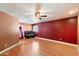 Spacious bedroom featuring hardwood floors, a ceiling fan and plenty of natural light at 18256 N 75Th Ave, Glendale, AZ 85308