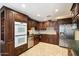 Gourmet kitchen with stainless steel appliances, custom cabinets, and tile floors, perfect for cooking at 18256 N 75Th Ave, Glendale, AZ 85308