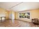 Bright living room with wood floors, large window, and cozy seating area at 18256 N 75Th Ave, Glendale, AZ 85308