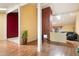 Open-concept living area with wood floors, a brick fireplace, and seamless flow to adjacent rooms at 18256 N 75Th Ave, Glendale, AZ 85308