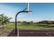 Modern community basketball court surrounded by green grass and beautiful landscaping at 1905 W Lariat Ln, Phoenix, AZ 85085