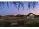 Inviting Union Park entrance with mountain views, landscape, and a charming guard house at 1905 W Lariat Ln, Phoenix, AZ 85085
