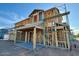 Image of a home under construction, featuring wood framing, scaffolding, and a clear blue sky above at 1905 W Lariat Ln, Phoenix, AZ 85085