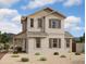 Charming two-story home with a covered porch and neutral-toned stucco exterior at 1905 W Lariat Ln, Phoenix, AZ 85085