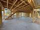 Home interior framing in progress, showing a staircase, exposed beams, and structural supports at 1905 W Lariat Ln, Phoenix, AZ 85085