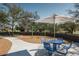 Community picnic area with seating, umbrella, and swings, a relaxing outdoor gathering space at 1905 W Lariat Ln, Phoenix, AZ 85085