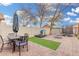 Gathering-friendly backyard with an outdoor table, playset, and well-maintained lawn at 2083 E Saratoga St, Gilbert, AZ 85296