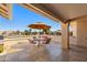 Relaxing covered patio with tiled floor, table, chairs, and views of the neighborhood at 2265 Leisure World --, Mesa, AZ 85206