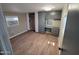 Bedroom with wood-look flooring and built-in gray dresser and closet area at 2345 E Main St # 48, Mesa, AZ 85213