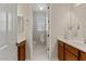 Bathroom featuring double sinks and a view into the separated toilet and shower area at 2670 E Parkview Dr, Gilbert, AZ 85295