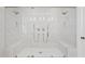 Sleek shower featuring tile, bench seating, and dual shower heads in a modern design at 2670 E Parkview Dr, Gilbert, AZ 85295