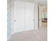 Bedroom featuring carpet and closet with sliding doors, providing ample storage space at 2670 E Parkview Dr, Gilbert, AZ 85295