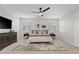 Stylish bedroom with ceiling fan, TV, carpet, and windows offering natural light at 2670 E Parkview Dr, Gilbert, AZ 85295