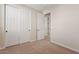 Bedroom showcasing carpeting and a closet, offering a cozy and functional space at 2670 E Parkview Dr, Gilbert, AZ 85295