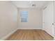 Bright bedroom with wood floors, closet, and window offers a relaxing atmosphere at 2670 E Parkview Dr, Gilbert, AZ 85295