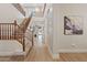 Inviting foyer with a grand staircase, hardwood floors, and elegant lighting fixtures at 2670 E Parkview Dr, Gilbert, AZ 85295