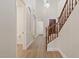 Hallway with wood floors, high ceilings, and access to a powder room and the main entrance at 2670 E Parkview Dr, Gilbert, AZ 85295