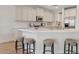 Well-appointed kitchen featuring quartz countertops, a breakfast bar with seating, and stainless steel appliances at 2670 E Parkview Dr, Gilbert, AZ 85295