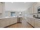 Modern kitchen with stainless steel appliances, quartz countertops, and easy access to the breakfast and dining area at 2670 E Parkview Dr, Gilbert, AZ 85295