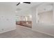 Spacious loft area featuring a ceiling fan and railing overlooking the lower level at 2670 E Parkview Dr, Gilbert, AZ 85295