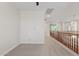 Spacious loft area with a ceiling fan and views of the house below at 2670 E Parkview Dr, Gilbert, AZ 85295