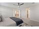 Spacious main bedroom with neutral tones, plush carpet, and an open doorway at 2670 E Parkview Dr, Gilbert, AZ 85295
