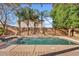Refreshing pool with elegant stone surround and lush trees creating a private oasis at 2670 E Parkview Dr, Gilbert, AZ 85295