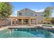 Backyard oasis featuring a refreshing pool, spa, and covered patio for outdoor relaxation at 2670 E Parkview Dr, Gilbert, AZ 85295