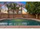 Backyard pool with stone border surrounded by mature desert landscaping at 2670 E Parkview Dr, Gilbert, AZ 85295
