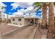 Charming single-story home with a covered parking area and mature palm trees in a well-maintained community at 2700 E Allred Ave # A3, Mesa, AZ 85204